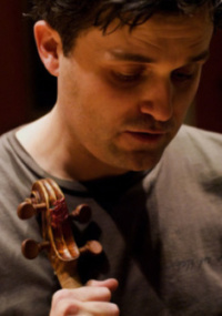 Violinist Peter Sheppard Skaerved holds Paganini's "Cannone" violin after a rehearsal at the Royal Academy of Music, London, 27 February 2006