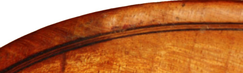 The purfling of this Lund violin shows his technique of folding the central strip in half and then glueing it